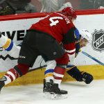 Arizona Coyotes defenseman Kevin Connauton, front, sends St. Louis Blues center Brayden Schenn, back, to the ice during the third period of an NHL hockey game Thursday, Feb. 14, 2019, in Glendale, Ariz. The Blues won 4-0. (AP Photo/Ross D. Franklin)