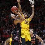 Utah's Timmy Allen, left, shoots as Arizona State's Taeshon Cherry (35) defends during the second half of an NCAA college basketball game Saturday, Feb. 16, 2019, in Salt Lake City. (AP Photo/Kim Raff)