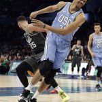 U.S. Team's Jarrett Allen, of the Brooklyn Nets, loses the ball as World Team's, Ben Simmons, of the Philadelphia 76ers picks it up during the NBA All-Star Rising Stars basketball game, Friday, Feb. 15, 2019, in Charlotte, N.C. (AP Photo/Chuck Burton)