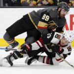 Vegas Golden Knights right wing Alex Tuch (89) falls onto Arizona Coyotes center Nick Cousins (25) during the second period of an NHL hockey game Tuesday, Feb. 12, 2019, in Las Vegas. (AP Photo/John Locher)