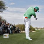 Rickie Fowler hits from the third tee during the third round of the Phoenix Open PGA golf tournament, Saturday, Feb. 2, 2019, in Scottsdale, Ariz. (AP Photo/Matt York)