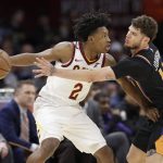 Cleveland Cavaliers' Collin Sexton, left, drives past Phoenix Suns' Tyler Johnson in the second half of an NBA basketball game, Thursday, Feb. 21, 2019, in Cleveland. (AP Photo/Tony Dejak)