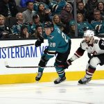 San Jose Sharks right wing Timo Meier (28) chases after the puck against Arizona Coyotes defenseman Oliver Ekman-Larsson (23) during the first period of an NHL hockey game in San Jose, Calif., Saturday, Feb. 2, 2019. (AP Photo/Tony Avelar)