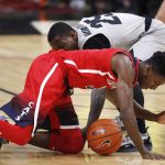 Arizona guard Dylan Smith, front, fights for control of a loose ball with Colorado guard McKinley Wright IV in the first half of an NCAA college basketball game Sunday, Feb. 17, 2019, in Boulder, Colo. (AP Photo/David Zalubowski)