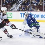 Vancouver Canucks goalie Jacob Markstrom, right, of Sweden, stops Arizona Coyotes' Mario Kempe, of Sweden, during the first period of an NHL hockey game Thursday, Feb. 21, 2019, in Vancouver, British Columbia. (Darryl Dyck/The Canadian Press via AP)