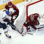 Arizona Coyotes goaltender Darcy Kuemper (35) makes a save on a shot by St. Louis Blues left wing Pat Maroon (7) as Coyotes defenseman Kevin Connauton (44) applies pressure during the first period of an NHL hockey game Thursday, Feb. 14, 2019, in Glendale, Ariz. (AP Photo/Ross D. Franklin)