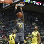 Arizona State's Luguentz Dort, center, dunks between Oregon's Louis King, left, and Francis Okoro, right, during the first half of an NCAA college basketball game Thursday, Feb. 28, 2019, in Eugene, Ore. (AP Photo/Chris Pietsch)