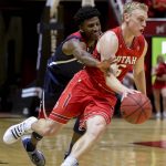 Arizona guard Dylan Smith, left, guards against Utah guard Parker Van Dyke, right, during the second half of an NCAA college basketball game Thursday, Feb. 14, 2019, in Salt Lake City. (AP Photo/Alex Goodlett)