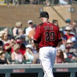 Arizona Diamondbacks starting pitcher Merrill Kelly is pulled from the game after allowing three runs during the first inning of the team's spring training baseball game against the Cleveland Indians, Thursday, Feb. 28, 2019, in Scottsdale, Ariz. (AP Photo/Matt York)