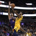 Utah Jazz's Royce O'Neale, right, attempts a layup as Phoenix Suns' Kelly Oubre Jr. (3) defends during the second half of an NBA basketball game on Wednesday, Feb. 6, 2019, in Salt Lake City. (AP Photo/Kim Raff)