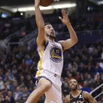 Golden State Warriors guard Klay Thompson (11) drives past Phoenix Suns forward Mikal Bridges (25) during the first half of an NBA basketball game Friday, Feb. 8, 2019, in Phoenix. (AP Photo/Ross D. Franklin)