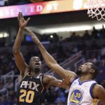 Phoenix Suns forward Josh Jackson (20) gets off a shot over Golden State Warriors forward Kevin Durant during the second half of an NBA basketball game Friday, Feb. 8, 2019, in Phoenix. The Warriors won 117-107. (AP Photo/Ross D. Franklin)