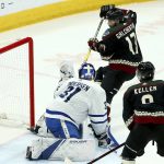Arizona Coyotes center Alex Galchenyuk (17) sends the puck past Toronto Maple Leafs goaltender Frederik Andersen (31) for a goal as Coyotes center Clayton Keller, right, looks on during the second period of an NHL hockey game Saturday, Feb. 16, 2019, in Glendale, Ariz. (AP Photo/Ross D. Franklin)