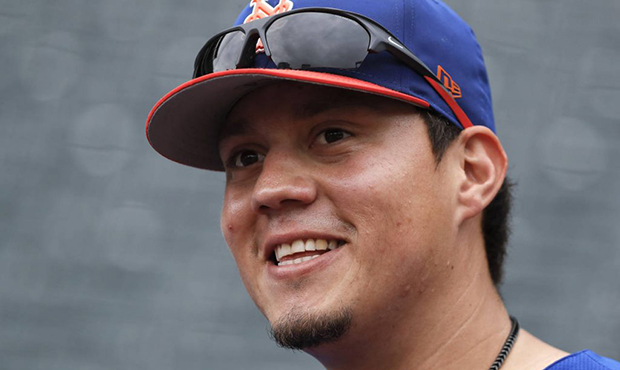 File-This June 27, 2018, file photo shows New York Mets' Wilmer Flores (4) before a baseball game a...