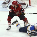 Arizona Coyotes defenseman Niklas Hjalmarsson (4) sends St. Louis Blues right wing Vladimir Tarasenko (91) to the ice during the second period of an NHL hockey game Thursday, Feb. 14, 2019, in Glendale, Ariz. (AP Photo/Ross D. Franklin)