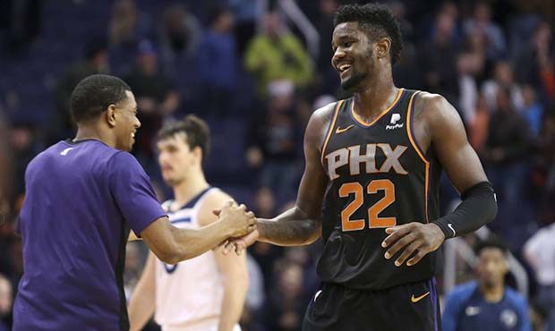 Phoenix Suns center Deandre Ayton (22) is congratulated by teammate De'Anthony Melton following a 1...