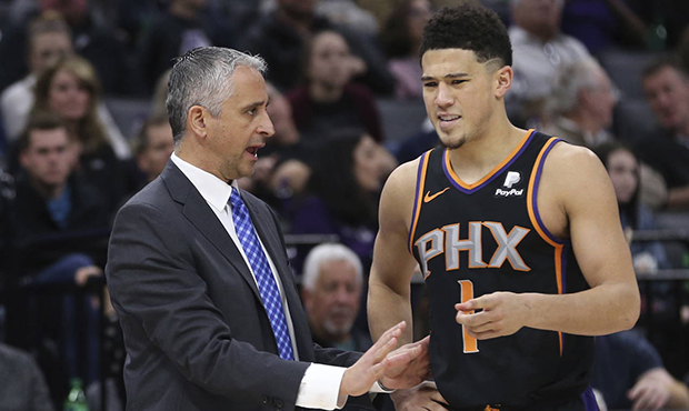 Phoenix Suns head coach Igor Kokoskov talks with Suns guard Devin Booker during the second half of ...