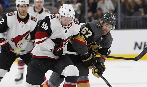 Arizona Coyotes left wing Michael Bunting (58) and Vegas Golden Knights left wing Max Pacioretty (6...