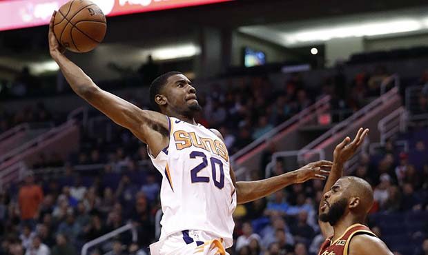Phoenix Suns forward Josh Jackson (20) dunks over Houston Rockets guard Chris Paul during the secon...