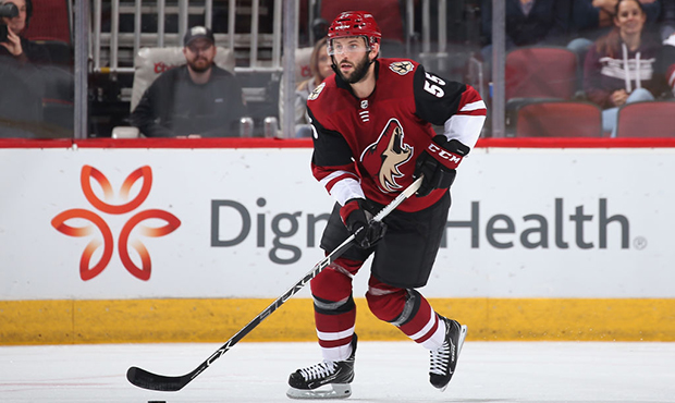 Jason Demers #55 of the Arizona Coyotes skates with the puck during the NHL game against the Ottawa...
