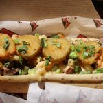 Reuben Some Dirt On It Dog: An 18-inch hot dog on a rye bun with Reuben mac and cheese, fried pickles, green onion and a secret sauce — $30 (June and July only)