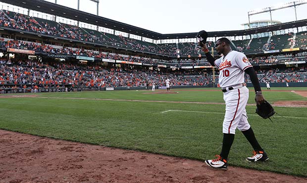 Adam Jones #10 of the Baltimore Orioles waves to crowd after being pulled from the game in the nint...