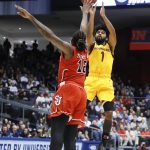 Arizona State's Remy Martin (1) shoots over St. John's Bryan Trimble Jr. (12) during the first half of a First Four game of the NCAA men's college basketball tournament Wednesday, March 20, 2019, in Dayton, Ohio. (AP Photo/John Minchillo)