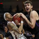 New Mexico State guard Trevelin Queen (20) and Grand Canyon's Alessandro Lever vie for a rebound during the first half of an NCAA college basketball game for the Western Athletic Conference men's tournament championship Saturday, March 16, 2019, in Las Vegas. (AP Photo/Steve Marcus)