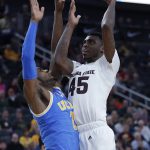 Arizona State's Zylan Cheatham shoots over UCLA's Cody Riley during the second half of an NCAA college basketball game in the quarterfinals of the Pac-12 men's tournament Thursday, March 14, 2019, in Las Vegas. (AP Photo/John Locher)