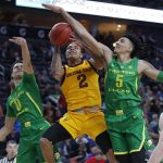 Arizona State's Rob Edwards (2) tries to shoot around Oregon's Will Richardson, left, and Oregon's Miles Norris during the first half of an NCAA college basketball game in the semifinals of the Pac-12 men's tournament Friday, March 15, 2019, in Las Vegas. (AP Photo/John Locher)