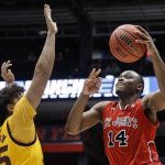 St. John's Mustapha Heron (14) shoots over Arizona State's Taeshon Cherry during the second half of a First Four game of the NCAA men's college basketball tournament Wednesday, March 20, 2019, in Dayton, Ohio. (AP Photo/John Minchillo)