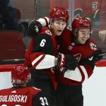 Arizona Coyotes defenseman Jakob Chychrun (6) celebrates his goal against the Calgary Flames with defenseman Alex Goligoski (33) and center Clayton Keller, right, during the third period of an NHL hockey game Thursday, March 7, 2019, in Glendale, Ariz. The Coyotes won 2-0. (AP Photo/Ross D. Franklin)