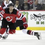 New Jersey Devils center Blake Coleman, front, is tripped up by Arizona Coyotes defenseman Oliver Ekman-Larsson (23), of Sweden, during the second period of an NHL hockey game, Saturday, March 23, 2019, in Newark, N.J. (AP Photo/Julio Cortez)