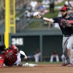Cleveland Indians second baseman Jason Kipnis, right, throws to first base after forcing out Arizona Diamondbacks' Ketel Marte at second base in the third inning of a spring training baseball game Thursday, March 7, 2019, in Scottsdale, Ariz. Diamondbacks' Wilmer Flores was out at first on the double play. (AP Photo/Elaine Thompson)