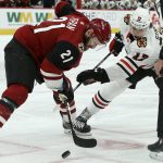 Arizona Coyotes center Derek Stepan (21) beats Chicago Blackhawks center Dylan Strome (17) to the puck on a face off during the first period of an NHL hockey game Tuesday, March 26, 2019, in Glendale, Ariz. (AP Photo/Ross D. Franklin)