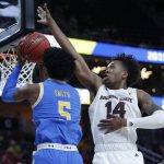 Arizona State's Kimani Lawrence, right, blocks a shot by UCLA's Chris Smith during the first half of an NCAA college basketball game in the quarterfinals of the Pac-12 men's tournament Thursday, March 14, 2019, in Las Vegas. (AP Photo/John Locher)