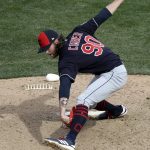 Cleveland Indians relief pitcher Adam Cimber winds up against the Arizona Diamondbacks in the fifth inning of a spring training baseball game Thursday, March 7, 2019, in Scottsdale, Ariz. (AP Photo/Elaine Thompson)