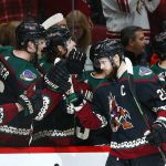 Arizona Coyotes defenseman Oliver Ekman-Larsson (23) celebrates his goal against the Detroit Red Wings with teammates on the bench during the first period of an NHL hockey game Saturday, March 2, 2019, in Glendale, Ariz. (AP Photo/Ross D. Franklin)