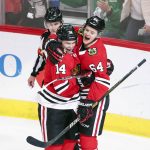 Chicago Blackhawks left wing Chris Kunitz (14) celebrates with center David Kampf (64) after scoring against the Arizona Coyotes during the second period of an NHL hockey game Monday, March 11, 2019, in Chicago. (AP Photo/Kamil Krzaczynski)