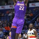 Phoenix Suns center Deandre Ayton (22) dunks the ball during the first half of an NBA basketball game against the New Orleans Pelicans in New Orleans, Saturday, March 16, 2019. (AP Photo/Tyler Kaufman)