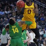 Arizona State's Luguentz Dort (0) fouls Oregon's Kenny Wooten during the first half of an NCAA college basketball game in the semifinals of the Pac-12 men's tournament Friday, March 15, 2019, in Las Vegas. (AP Photo/John Locher)