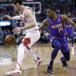 Chicago Bulls guard Ryan Arcidiacono steals the ball from Phoenix Suns guard De'Anthony Melton (14) during the first half of an NBA basketball game, Monday, March 18, 2019, in Phoenix. (AP Photo/Matt York)