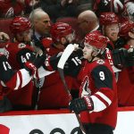 Arizona Coyotes center Clayton Keller (9) celebrates his goal against the Calgary Flames during the first period of an NHL hockey game Thursday, March 7, 2019, in Glendale, Ariz. (AP Photo/Ross D. Franklin)