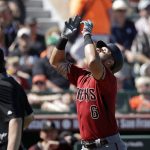 Arizona Diamondbacks' David Peralta gestures skyward as he heads home on his solo home run against the San Francisco Giants in the third inning of a spring training baseball game Saturday, March 23, 2019, in Scottsdale, Ariz. (AP Photo/Elaine Thompson)