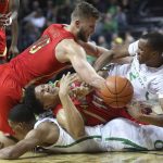 With Oregon's Kenny Wooten on the bottom left, Arizona's Ira Lee, center left, and Ryan Luther, top left, battle Oregon's Louis King, right, for a loose ball during the first half of an NCAA college basketball game Saturday, March 2, 2019, in Eugene, Ore. (AP Photo/Chris Pietsch)