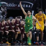Oregon's Ehab Amin celebrates after making a 3-point shot against Arizona State during the first half of an NCAA college basketball game in the semifinals of the Pac-12 men's tournament Friday, March 15, 2019, in Las Vegas. (AP Photo/John Locher)