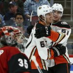 Anaheim Ducks right wing Troy Terry (61) celebrates his goal against Arizona Coyotes goaltender Darcy Kuemper (35) with left wing Rickard Rakell (67) during the third period of an NHL hockey game Tuesday, March 5, 2019, in Glendale, Ariz. The Ducks won 3-1. (AP Photo/Ross D. Franklin)