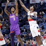 Phoenix Suns forward Kelly Oubre Jr. (3) shoots over New Orleans Pelicans guard Elfrid Payton (4) during the first half of an NBA basketball game in New Orleans, Saturday, March 16, 2019. (AP Photo/Tyler Kaufman)