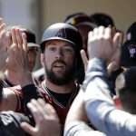 Arizona Diamondbacks' Steven Souza Jr. is congratulated after scoring against the Chicago Cubs in the first inning of a spring training baseball game Saturday, March 16, 2019, in Scottsdale, Ariz. (AP Photo/Elaine Thompson)