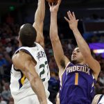 Utah Jazz center Rudy Gobert (27) blocks the shot of Phoenix Suns guard Devin Booker (1) during the first half of an NBA basketball game Monday, March 25, 2019, in Salt Lake City. (AP Photo/Rick Bowmer)